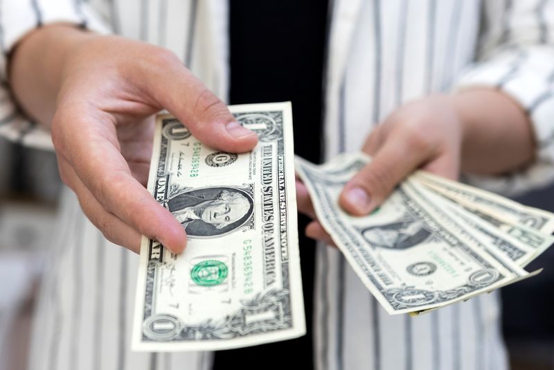 Dollar catches breath, Brazil real slides on tariff threat; bitcoin near record high