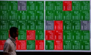 Asia shares slip as markets reprice Fed expectations, oil gains