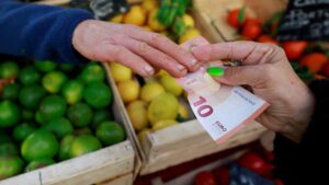Euro slides to 17-month low against dollar